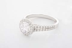 A rounded halo setting with stones along the band